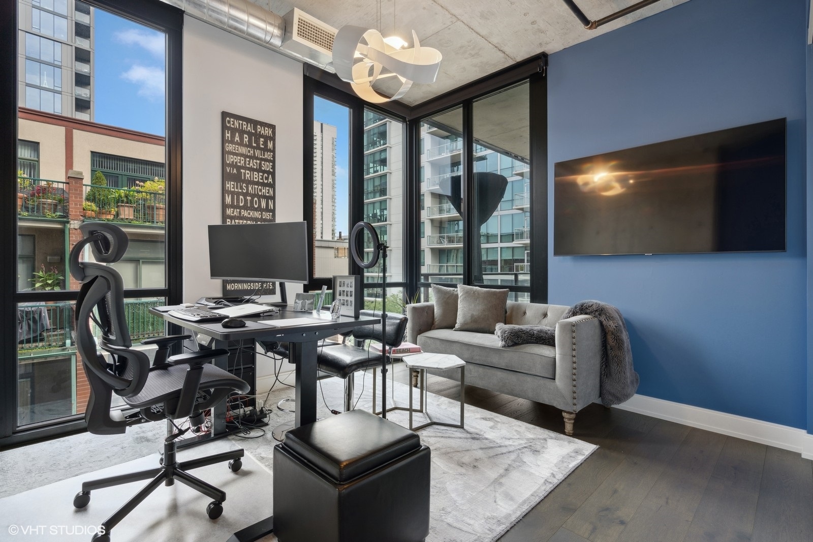 111 South Peoria Street, Unit 404 Chicago, IL 60607 - Photo 25 of 37 a living room with patio furniture and a flat screen tv