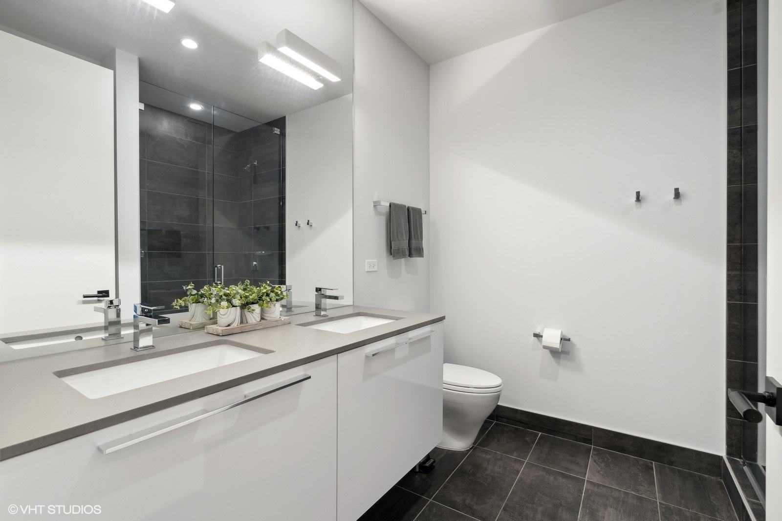 111 South Peoria Street, Unit 404 Chicago, IL 60607 - Photo 27 of 37 a bathroom with a sink toilet and shower