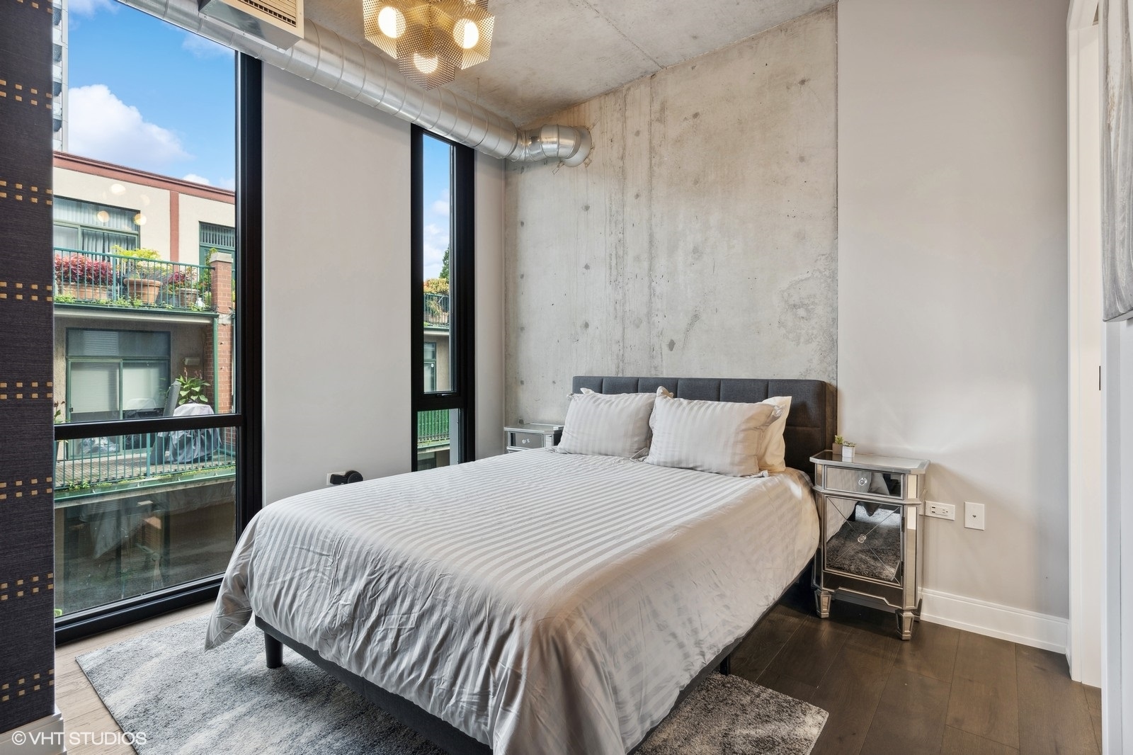 111 South Peoria Street, Unit 404 Chicago, IL 60607 - Photo 28 of 37 a bed sitting in a bedroom next to a window