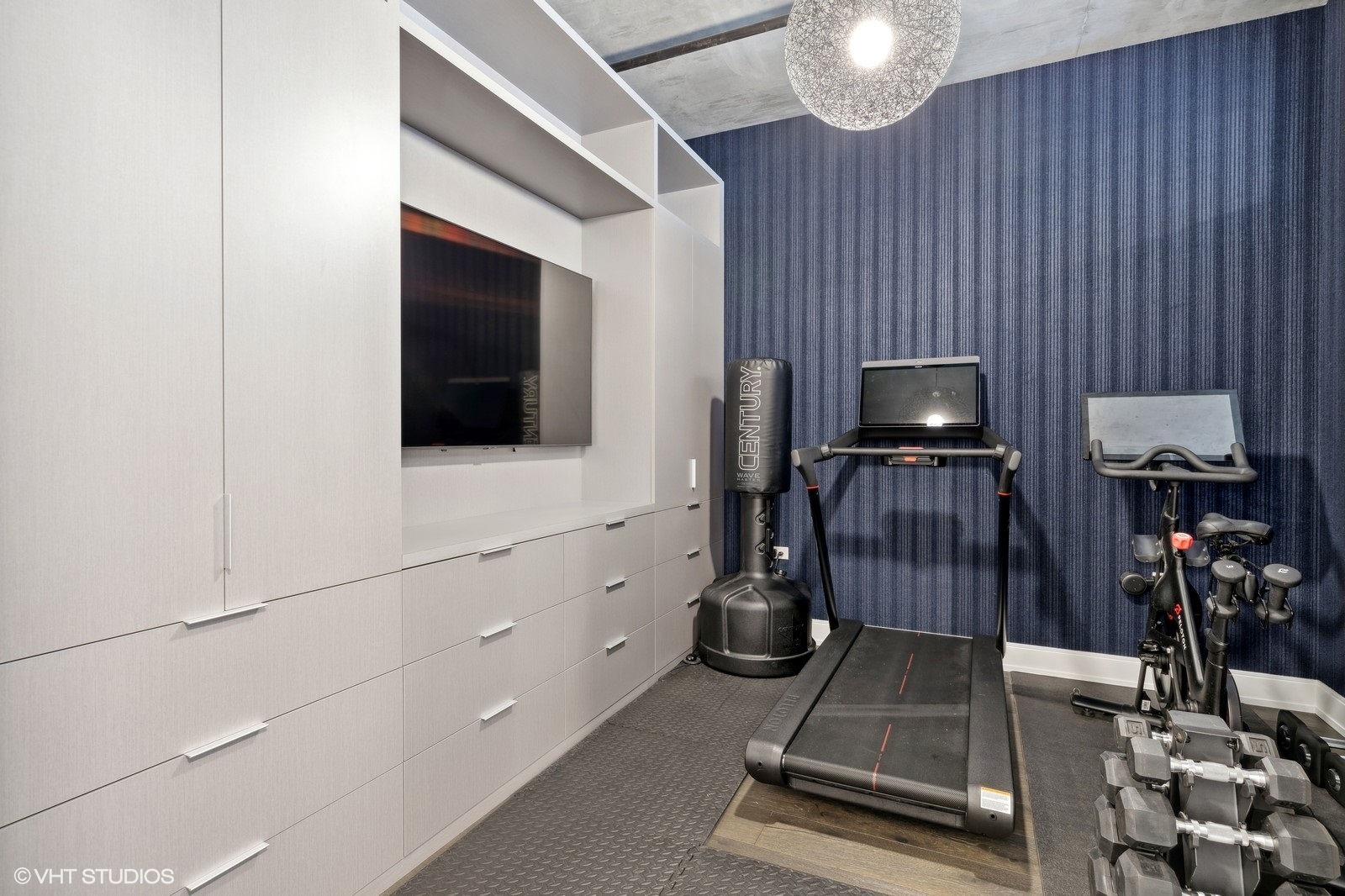 111 South Peoria Street, Unit 404 Chicago, IL 60607 - Photo 34 of 37 a living room with furniture a flat screen tv and kitchen view