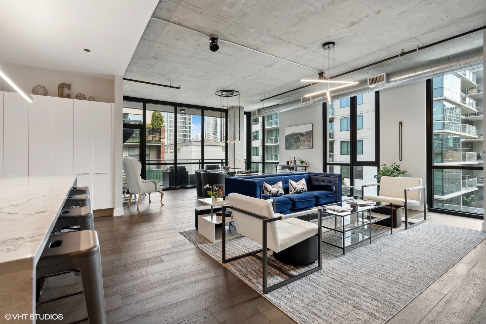 111 South Peoria Street, Unit 404 Chicago, IL 60607 - Photo 5 of 37 a living room with furniture and wooden floor