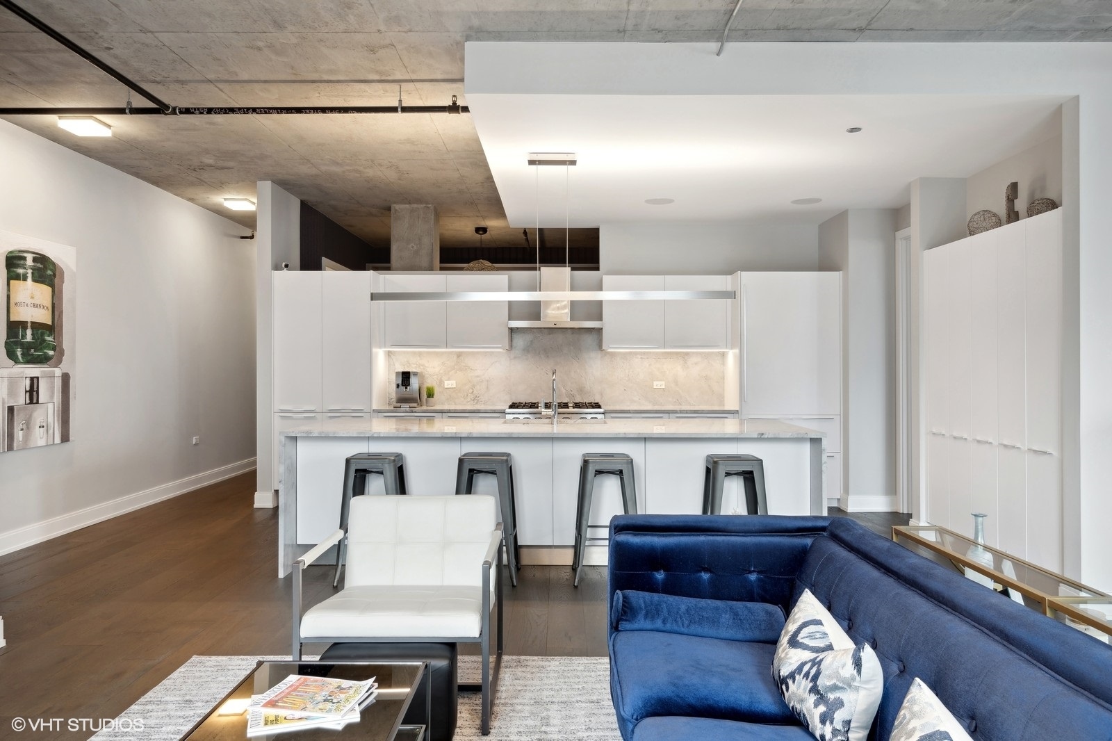 111 South Peoria Street, Unit 404 Chicago, IL 60607 - Photo 10 of 37 a kitchen with a table chairs and a refrigerator