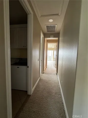 a view of a storage and utility room with a sink