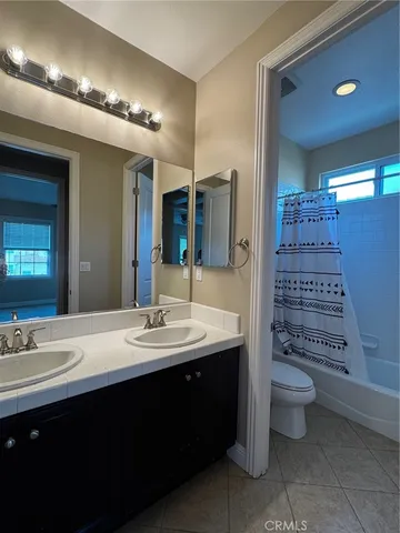 a bathroom with a sink and vanity