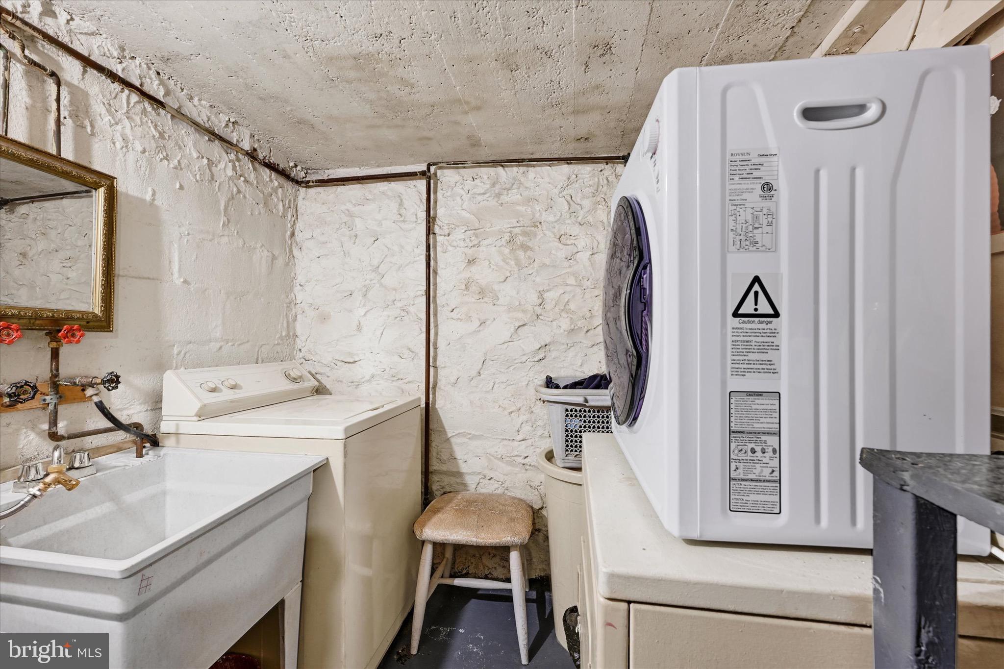 48 North Ellamont Street Baltimore, MD 21229 - Photo 18 of 26 a view of bathroom with a sink and mirror