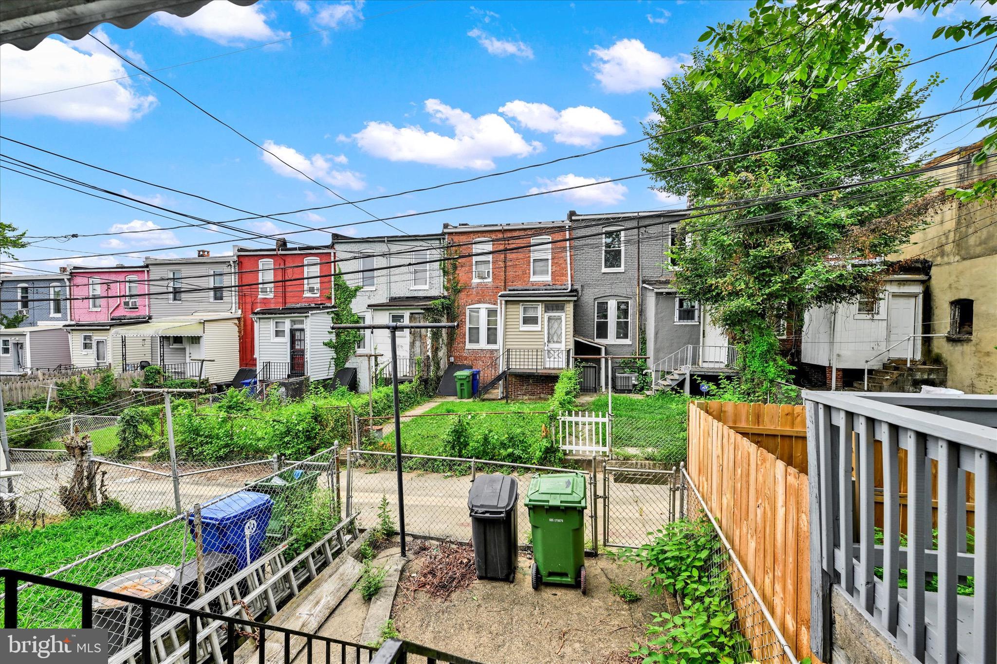 48 North Ellamont Street Baltimore, MD 21229 - Photo 23 of 26 a view of a chairs and table in backyard of the house
