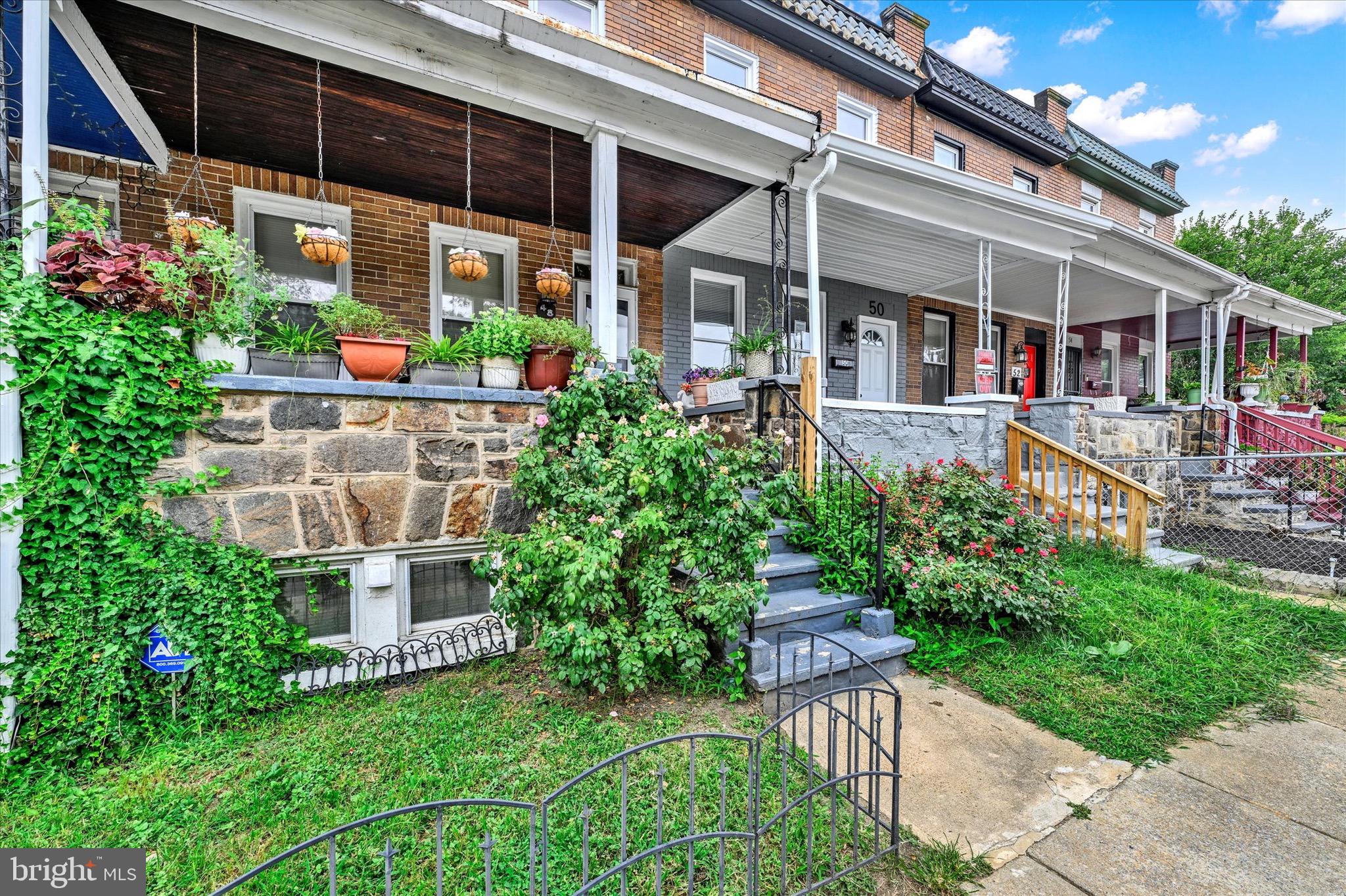 48 North Ellamont Street Baltimore, MD 21229 - Photo 5 of 26 front view of a house with a porch