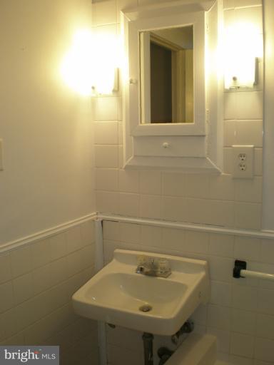 1520 Solomons Island Road Huntingtown, MD 20639 - Photo 22 of 30 Upper Level Bathroom with original cabinet, etc.