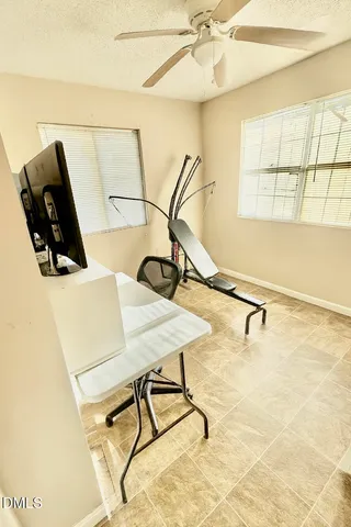 a room with gym equipment and a window
