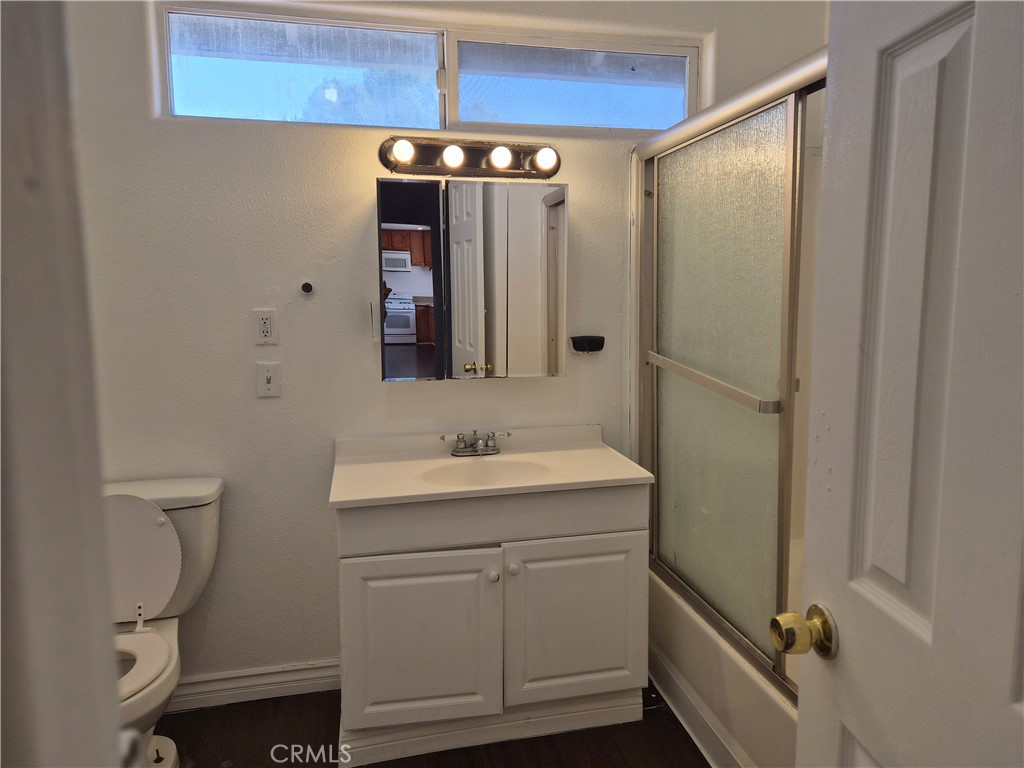 18749 Lemay Street Reseda, CA 91335 - Photo 12 of 17 a bathroom with a sink a toilet and shower