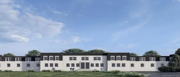 a view of building with a yard