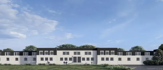 a view of building with a yard