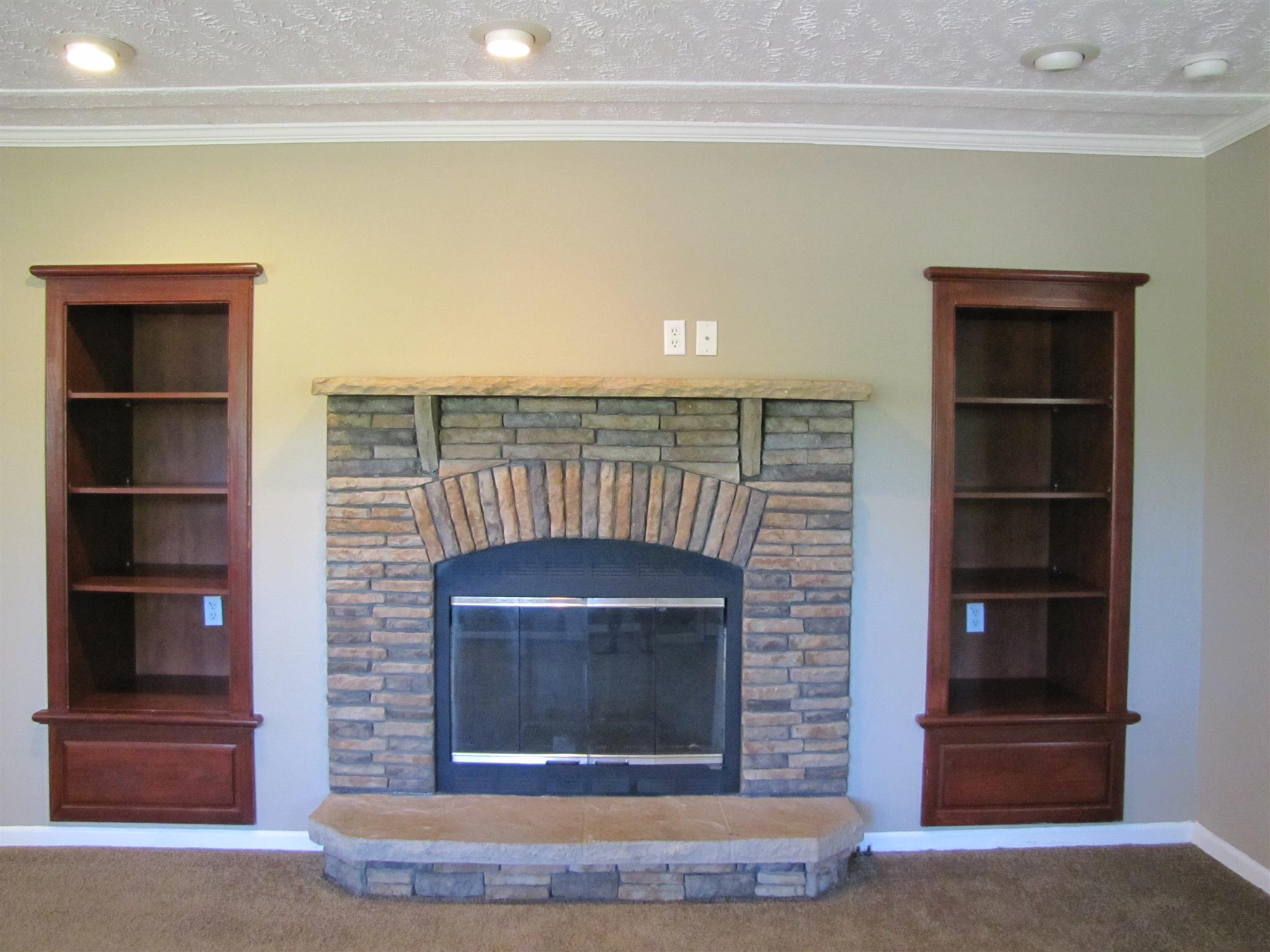 145 Womack Road Pelham, TN 37366 - Photo 3 of 19 a living room with a fireplace cabinet and a rug