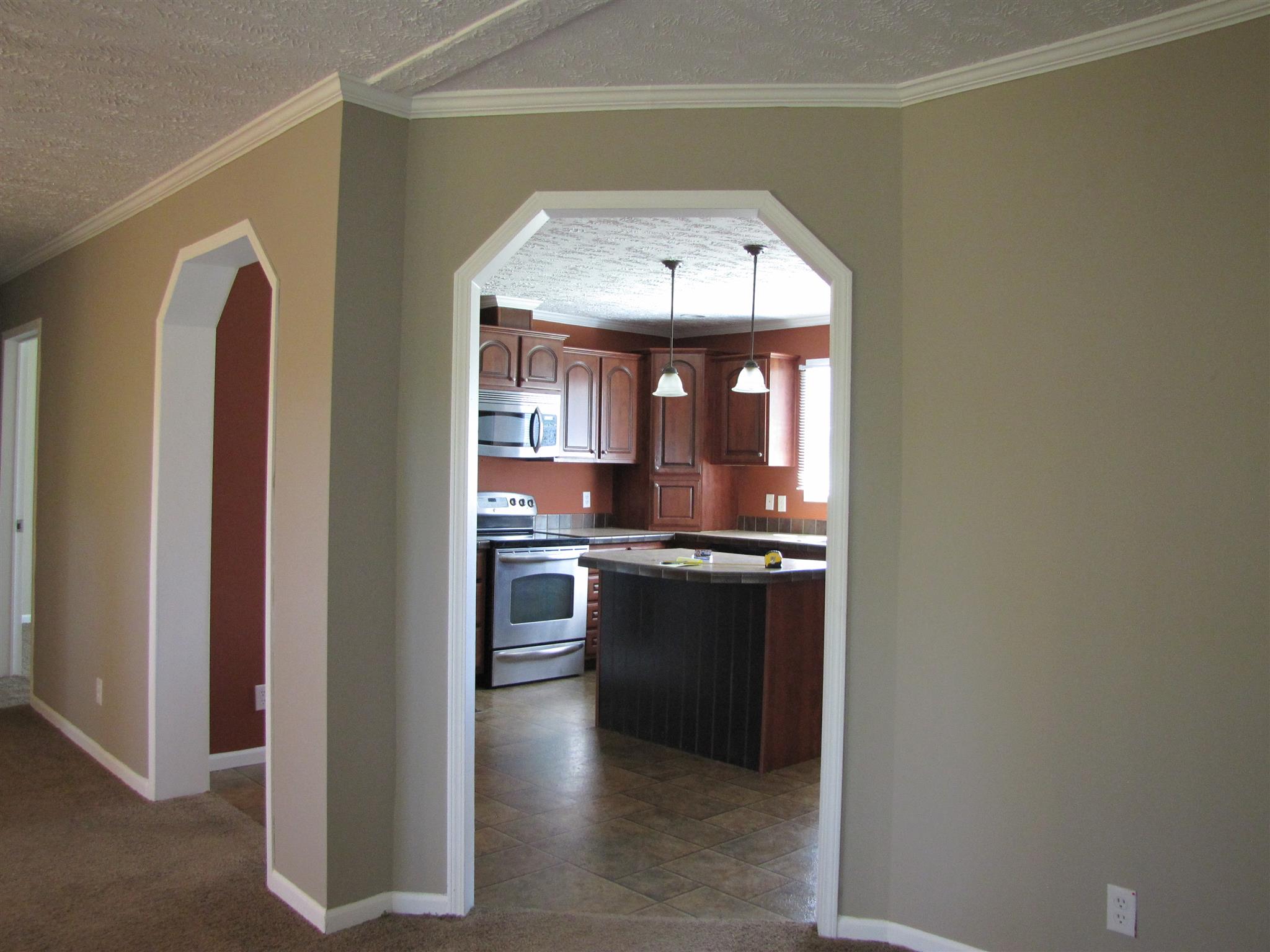 145 Womack Road Pelham, TN 37366 - Photo 5 of 19 a kitchen with stainless steel appliances granite countertop a stove and a refrigerator