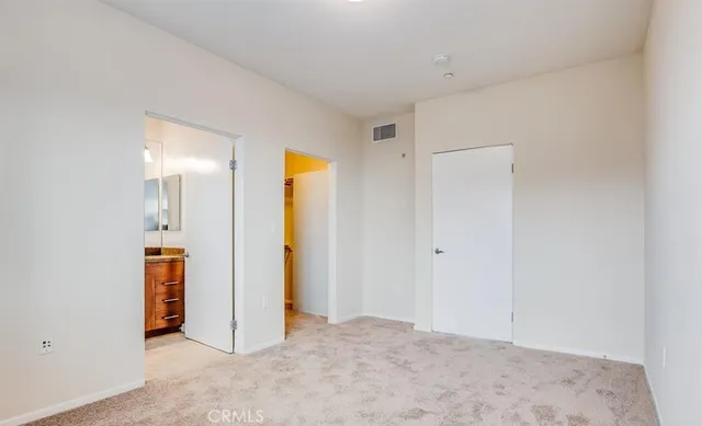 a view of a hallway with white walls