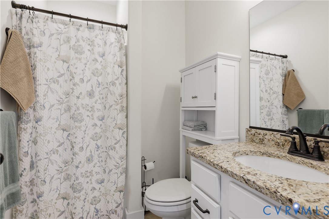 25181 West Soap Stone Road Jetersville, VA 23083 - Photo 26 of 54 Bathroom featuring a vanity with a granite-style c