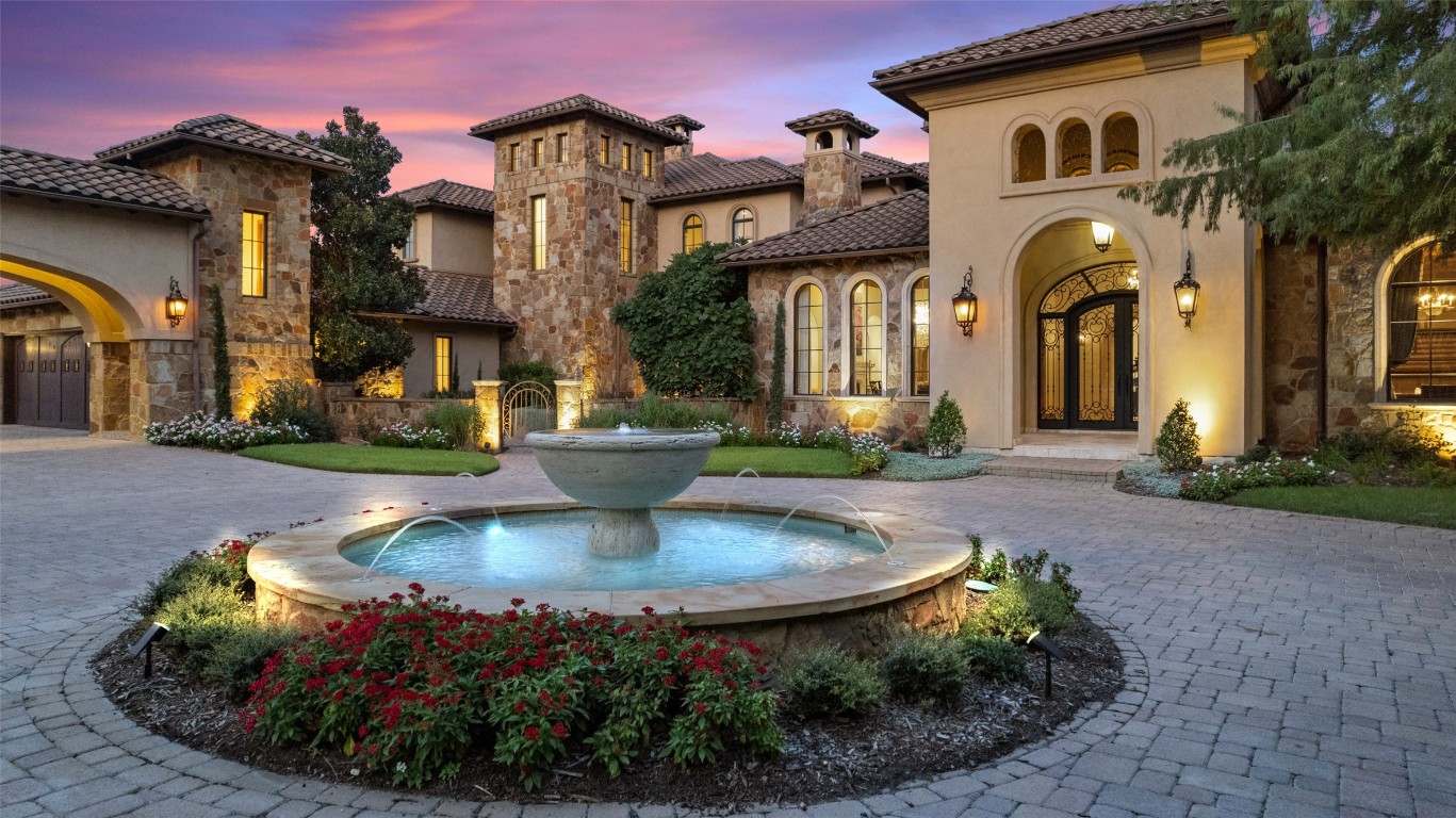 9209 Camelback Drive Austin, TX 78733 - Photo 1 of 1 a front view of a house with swimming pool