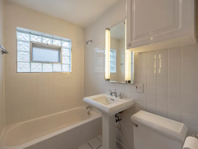 a bathroom with a sink toilet and bathtub