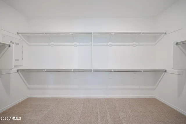 a view of an empty walk in closet