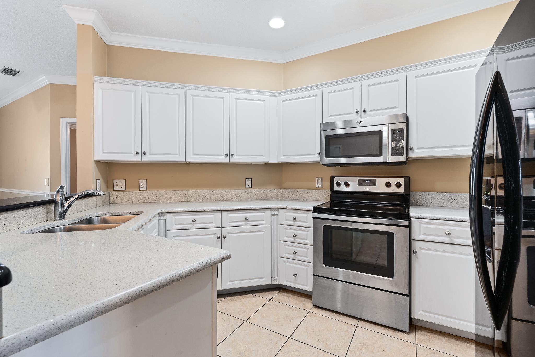 3425 Haley Pointe Road St. Augustine, FL 32084 - Photo 19 of 71 a kitchen with stainless steel appliances granite countertop a sink stove and microwave