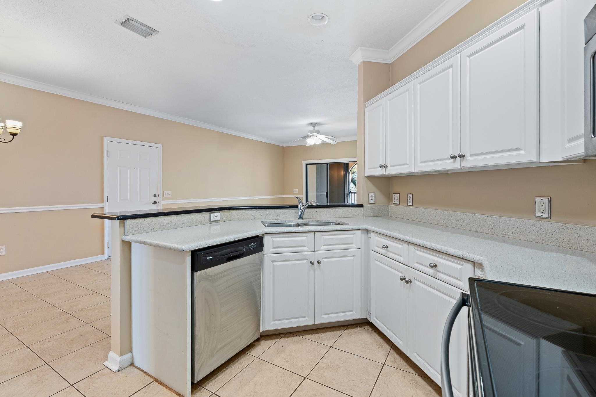 3425 Haley Pointe Road St. Augustine, FL 32084 - Photo 20 of 71 a kitchen with granite countertop white cabinets and white appliances