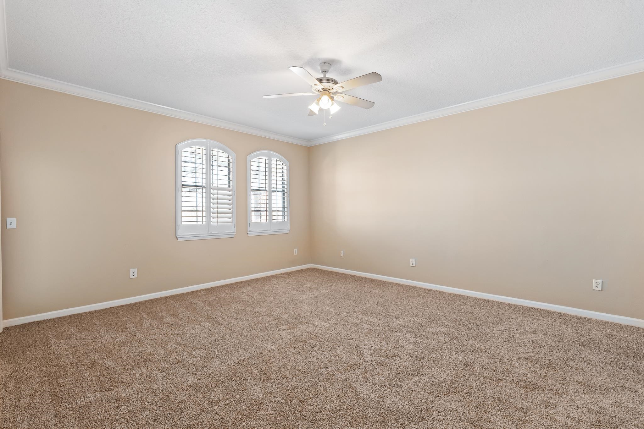 3425 Haley Pointe Road St. Augustine, FL 32084 - Photo 26 of 71 an empty room with windows and ceiling fan