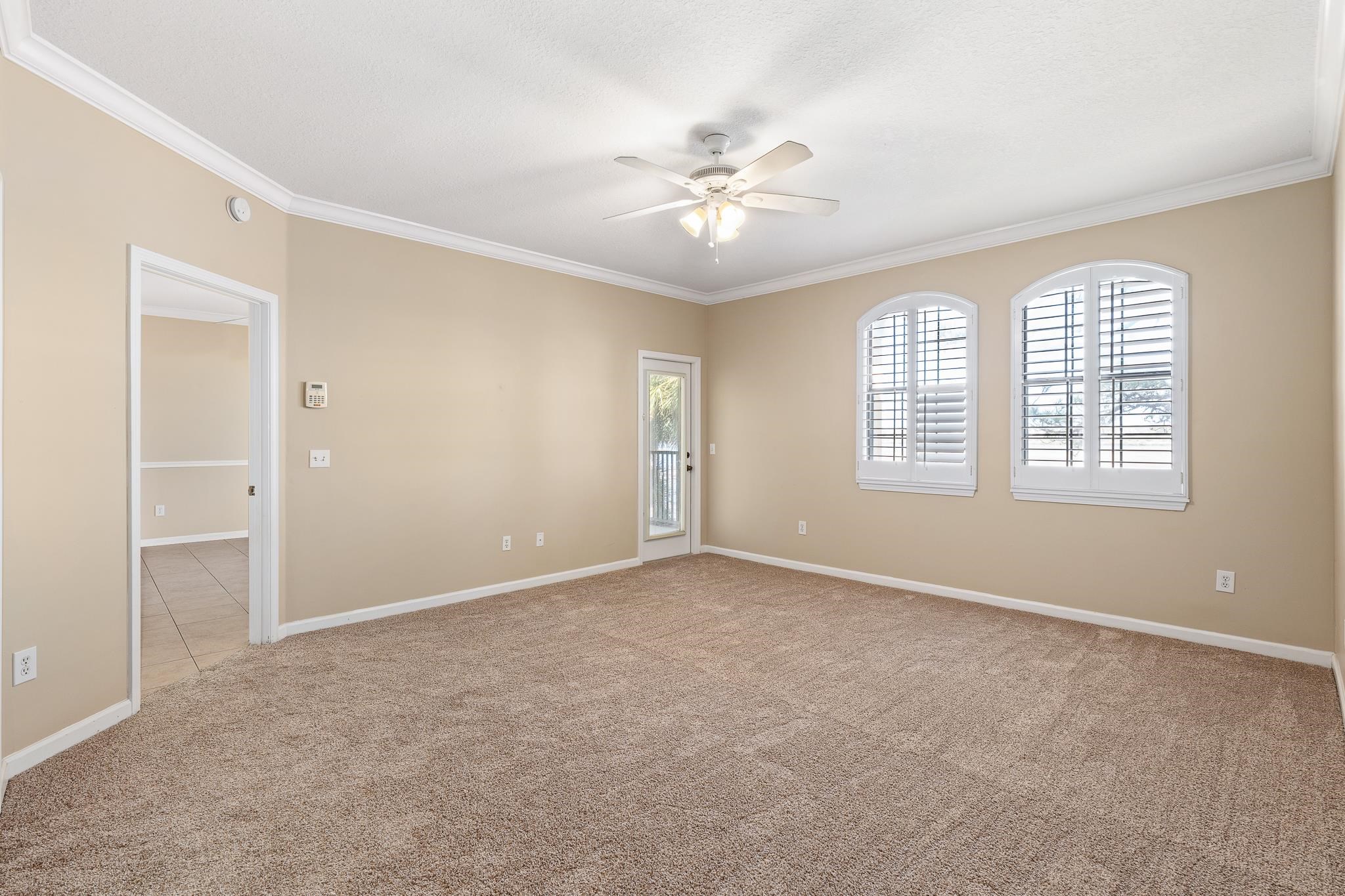 3425 Haley Pointe Road St. Augustine, FL 32084 - Photo 29 of 71 an empty room with chandelier fan and windows