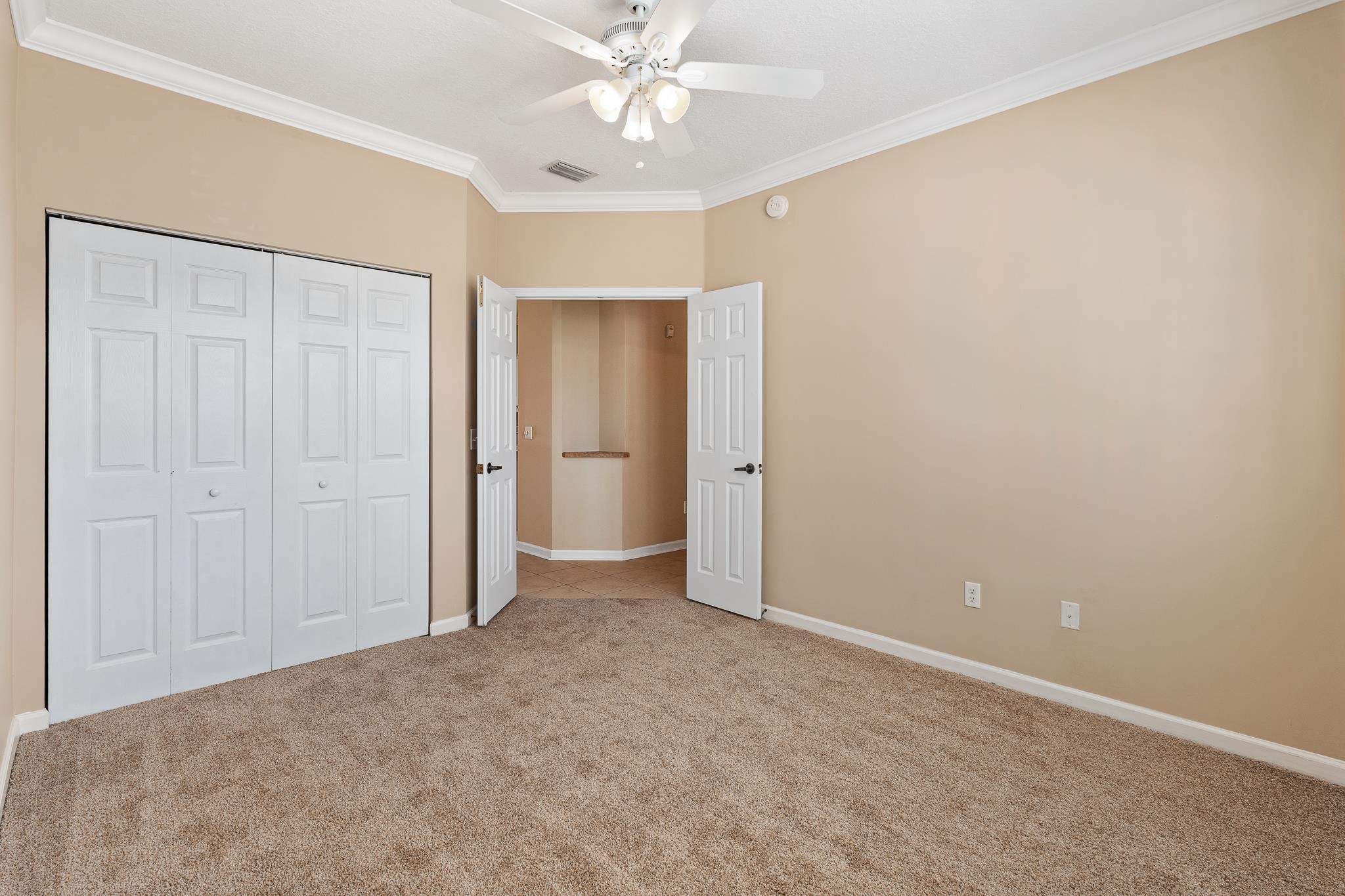 3425 Haley Pointe Road St. Augustine, FL 32084 - Photo 33 of 71 an empty room with closet and a chandelier fan