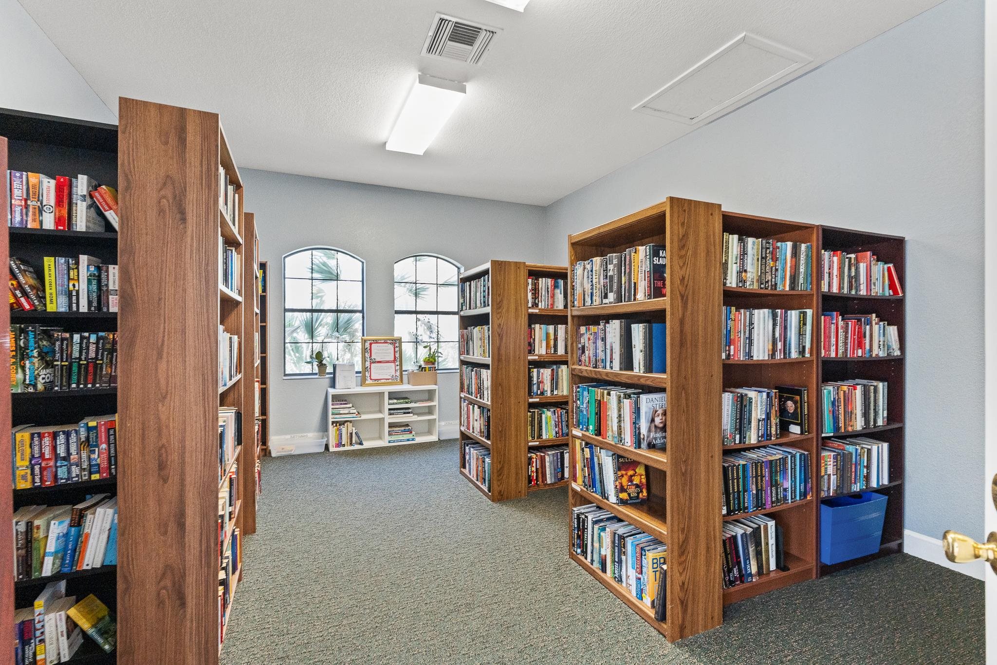 3425 Haley Pointe Road St. Augustine, FL 32084 - Photo 61 of 71 Misc room featuring dark carpet and bookshelves