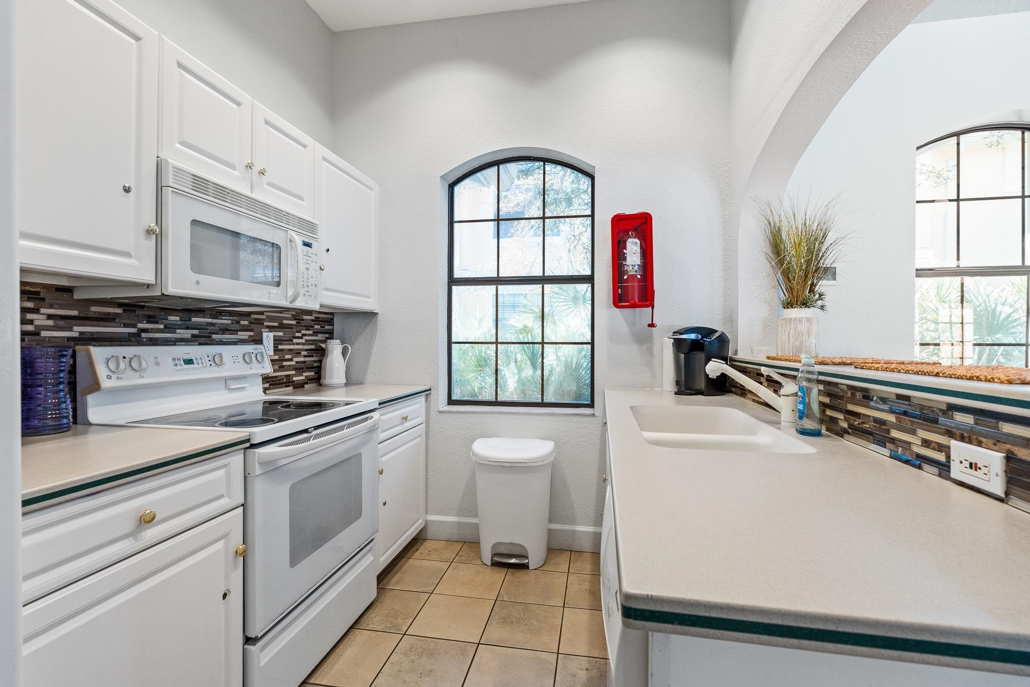 3425 Haley Pointe Road St. Augustine, FL 32084 - Photo 70 of 71 a kitchen with a stove a sink and a window