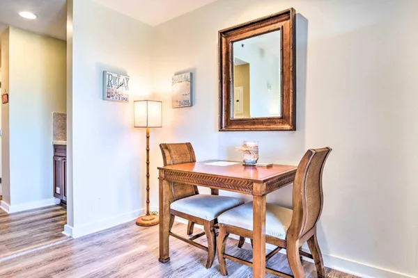 a dining room with furniture and wooden floor