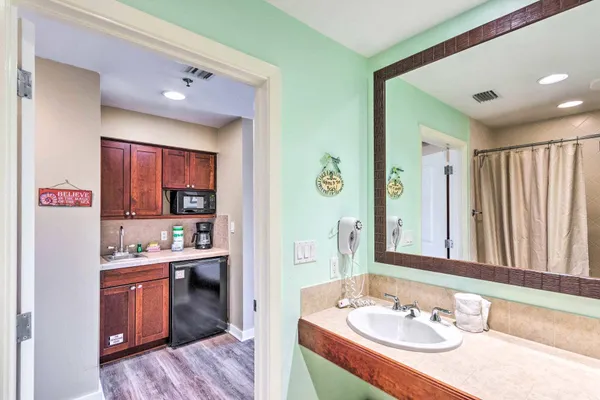 a en suite bathroom with a sink double vanity and a mirror