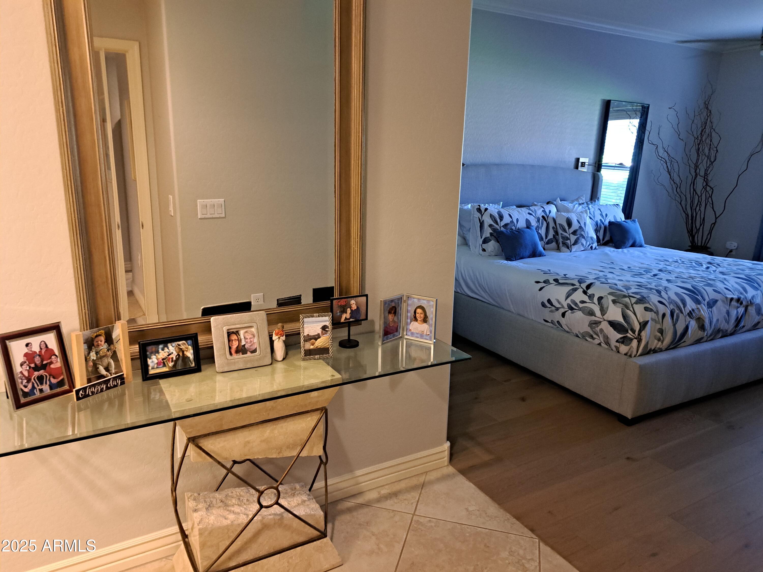 21320 North 56th Street, Unit 1163 Phoenix, AZ 85054 - Photo 16 of 48 a bedroom with a bed and a mirror