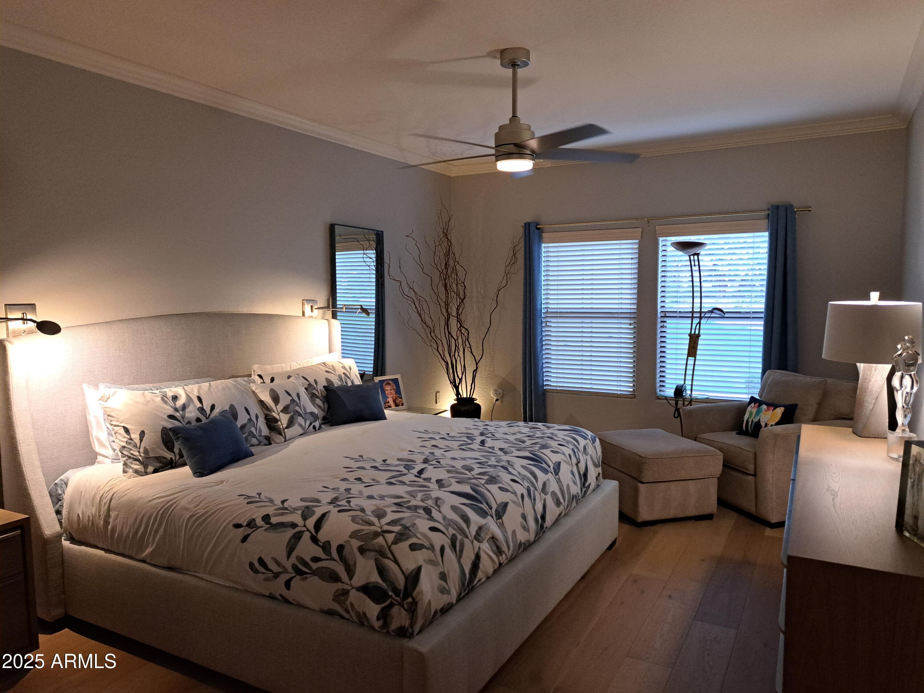 21320 North 56th Street, Unit 1163 Phoenix, AZ 85054 - Photo 17 of 48 a bedroom with a large bed couch and two windows