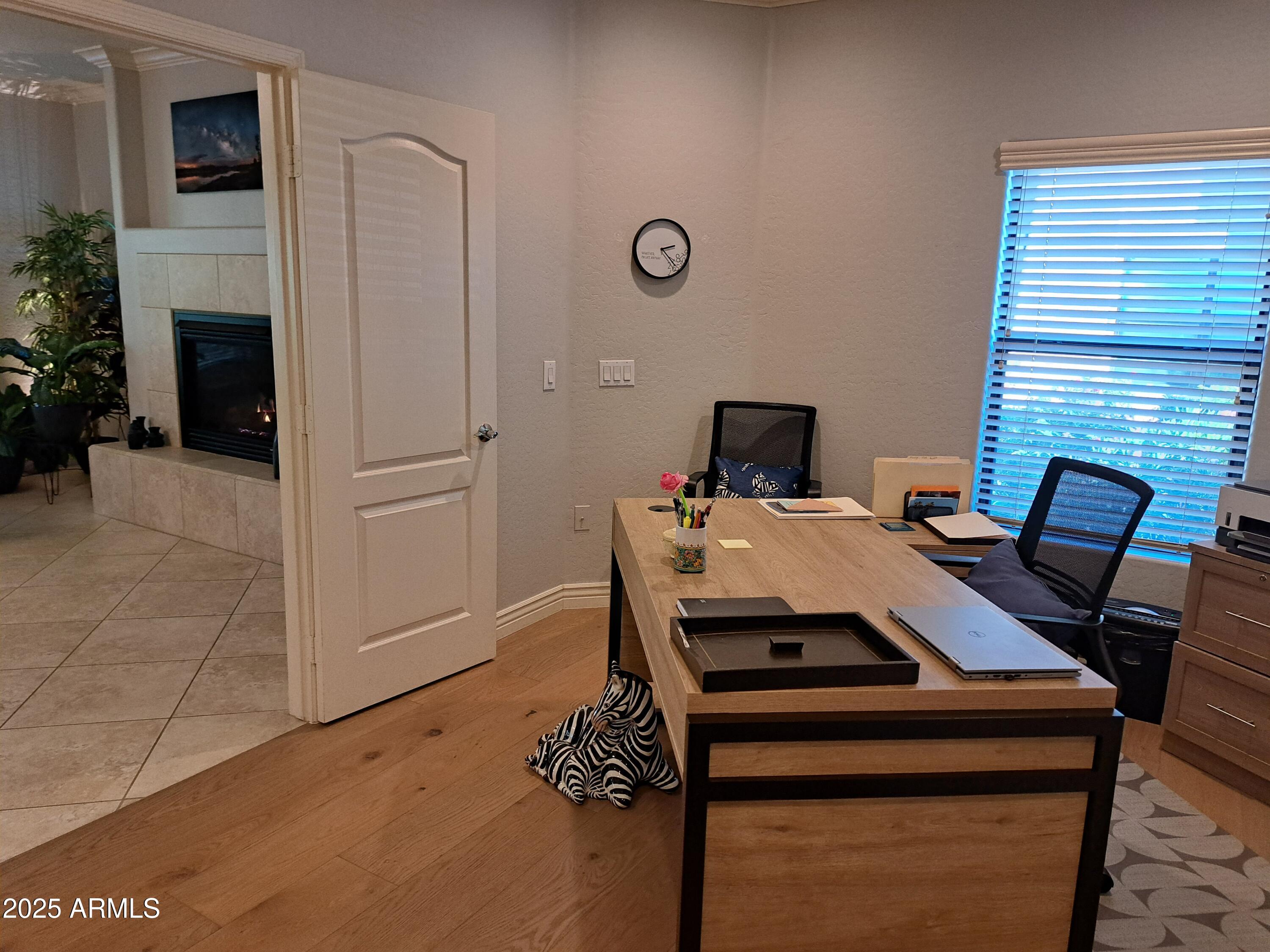21320 North 56th Street, Unit 1163 Phoenix, AZ 85054 - Photo 24 of 48 a view of a dining room with furniture and fireplace