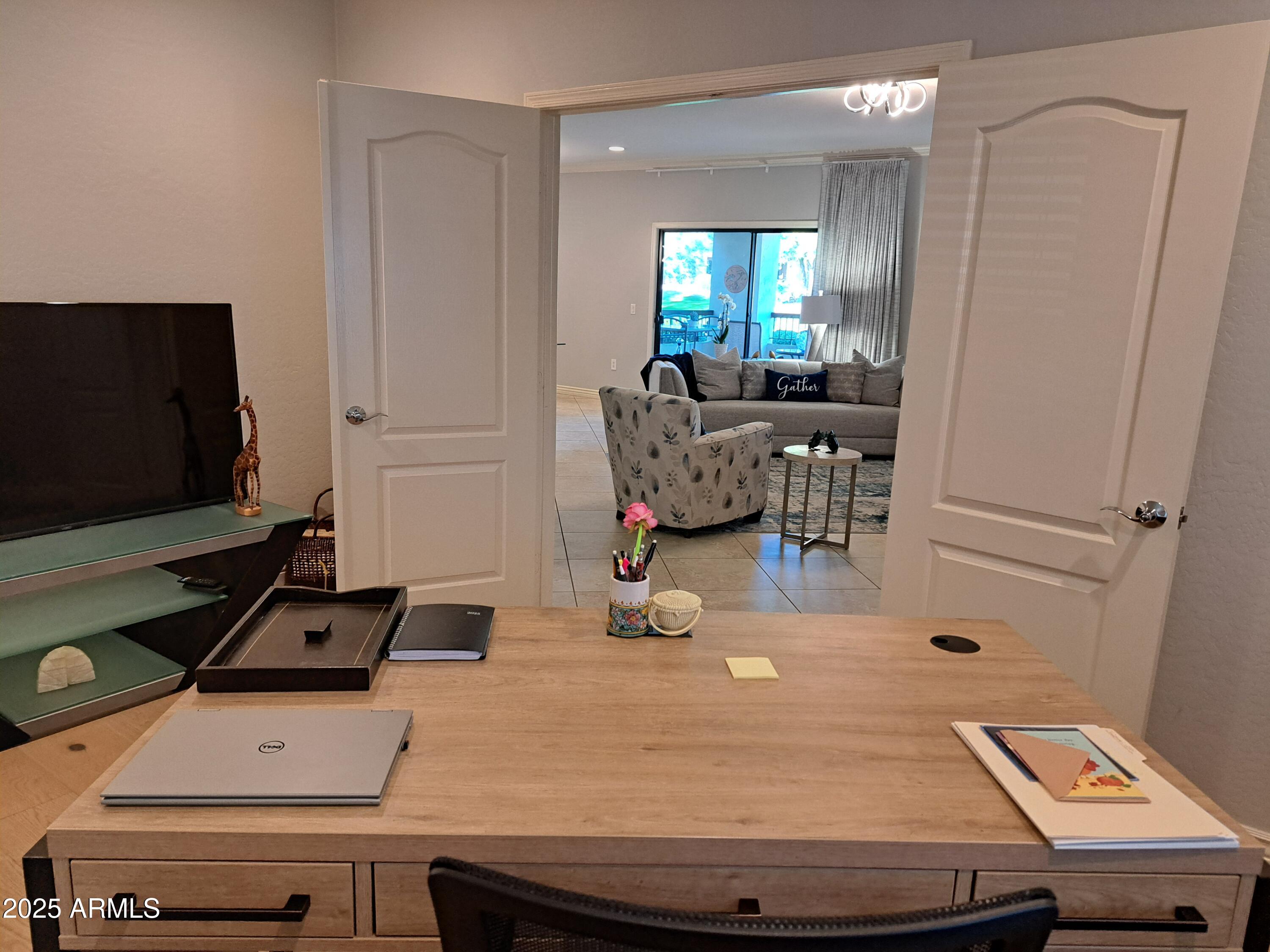 21320 North 56th Street, Unit 1163 Phoenix, AZ 85054 - Photo 25 of 48 a room with furniture and flat screen tv