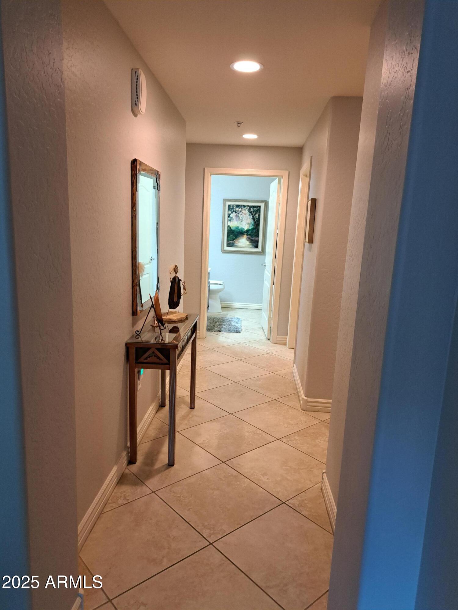 21320 North 56th Street, Unit 1163 Phoenix, AZ 85054 - Photo 35 of 48 a view of a hallway with a window