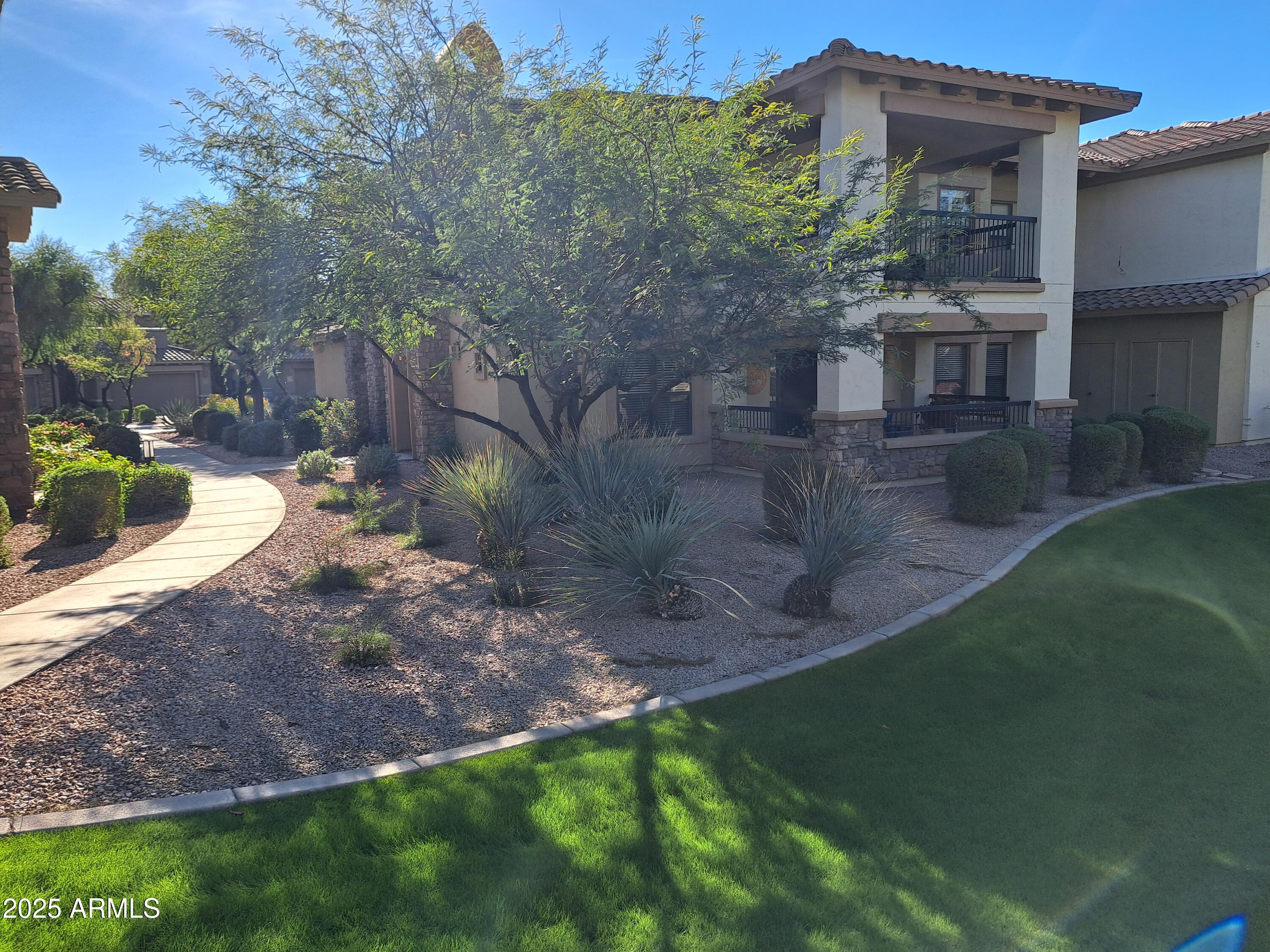 21320 North 56th Street, Unit 1163 Phoenix, AZ 85054 - Photo 41 of 48 a view of a house with a yard