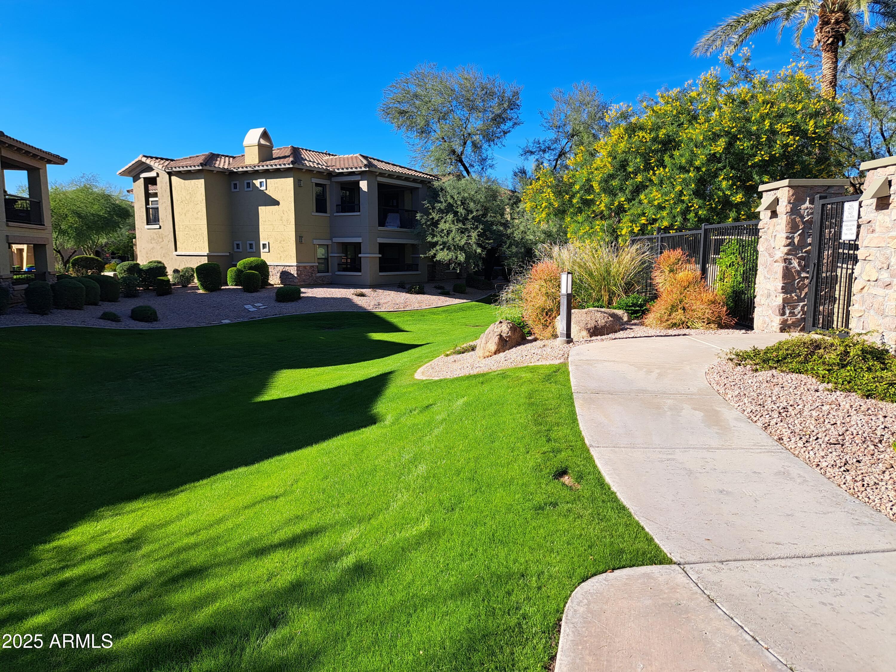 21320 North 56th Street, Unit 1163 Phoenix, AZ 85054 - Photo 42 of 48 a view of a house with a yard