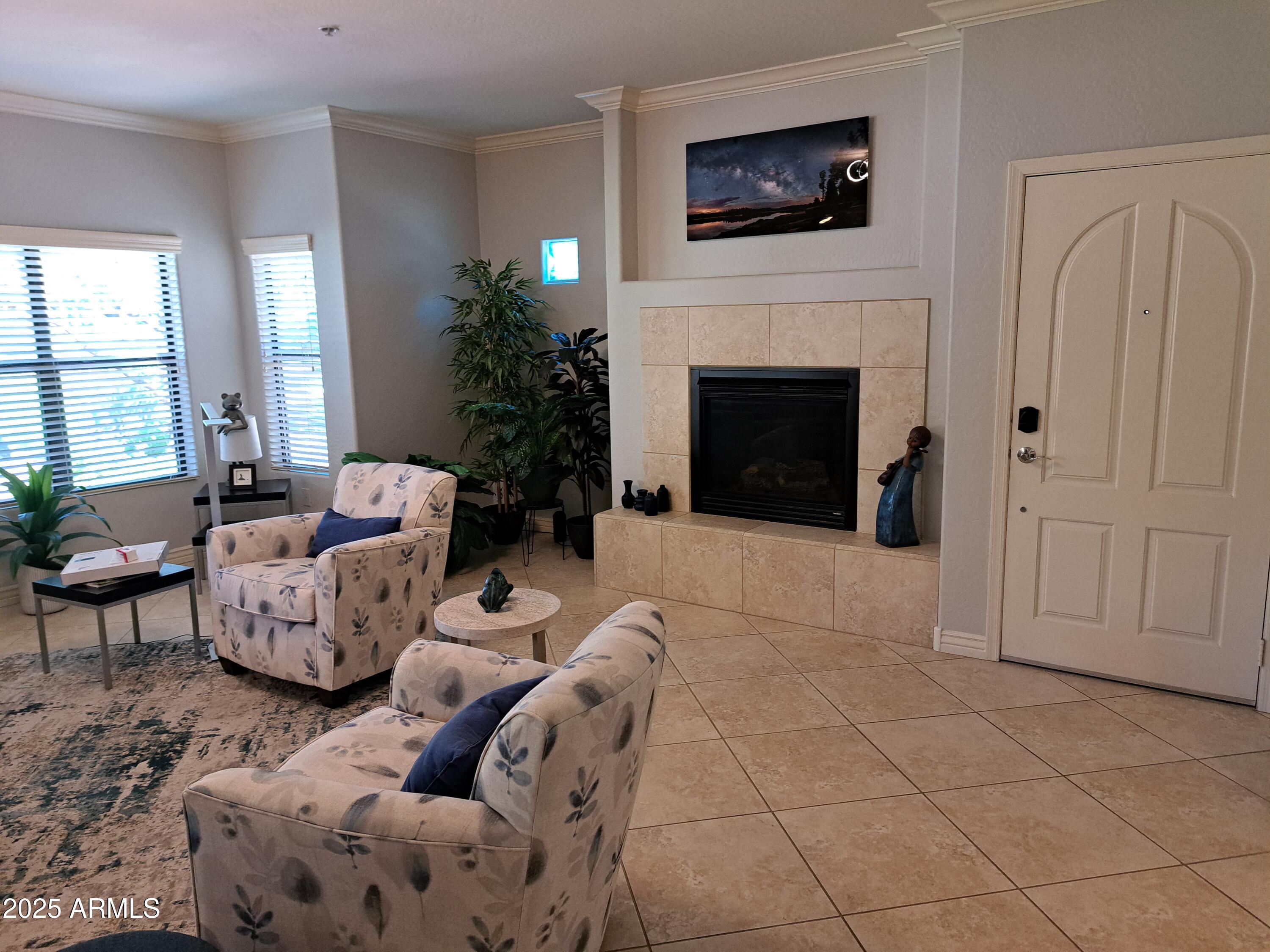 21320 North 56th Street, Unit 1163 Phoenix, AZ 85054 - Photo 7 of 48 a living room with furniture and a fireplace
