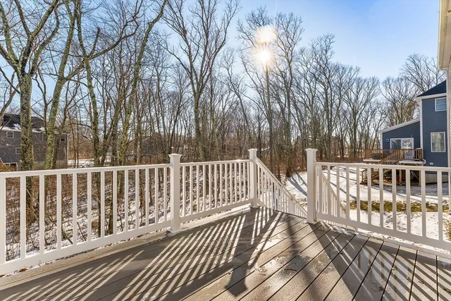 a view of a house with wooden deck