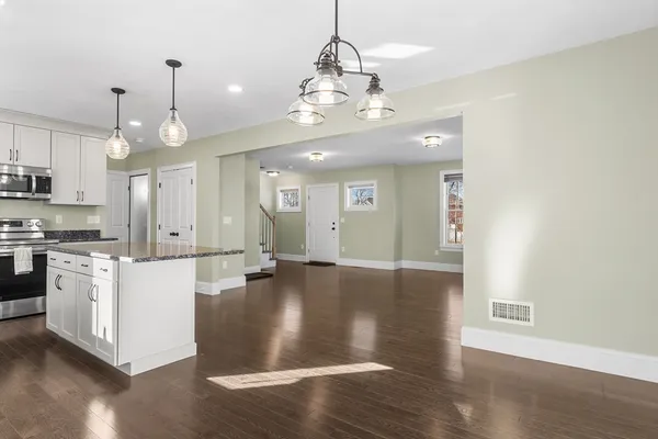 a view of a kitchen with stove and cabinets