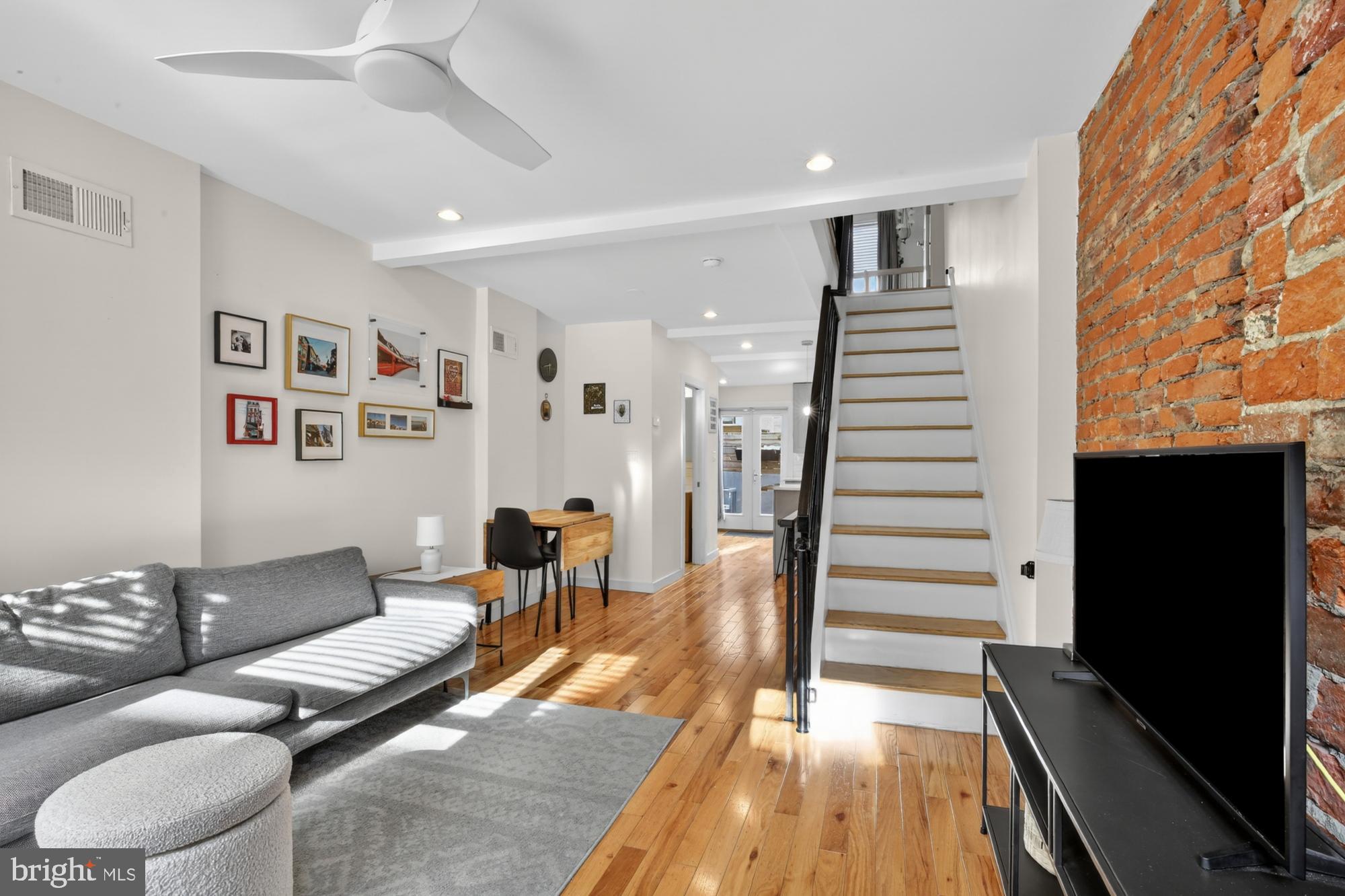 741 Watkins Street Philadelphia, PA 19148 - Photo 1 of 25 a living room with furniture and wooden floor