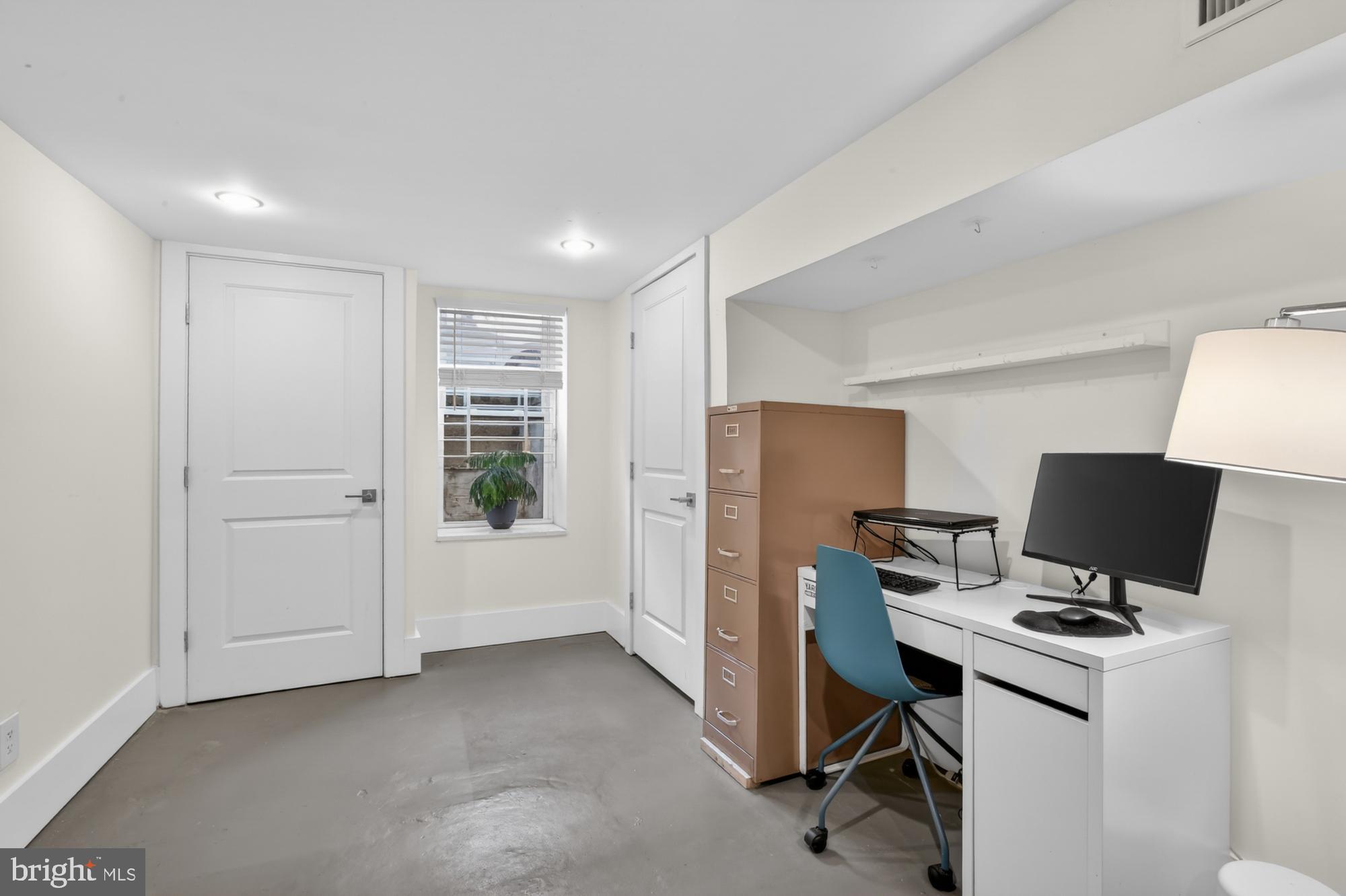 741 Watkins Street Philadelphia, PA 19148 - Photo 11 of 25 a view of a workspace with furniture and a window