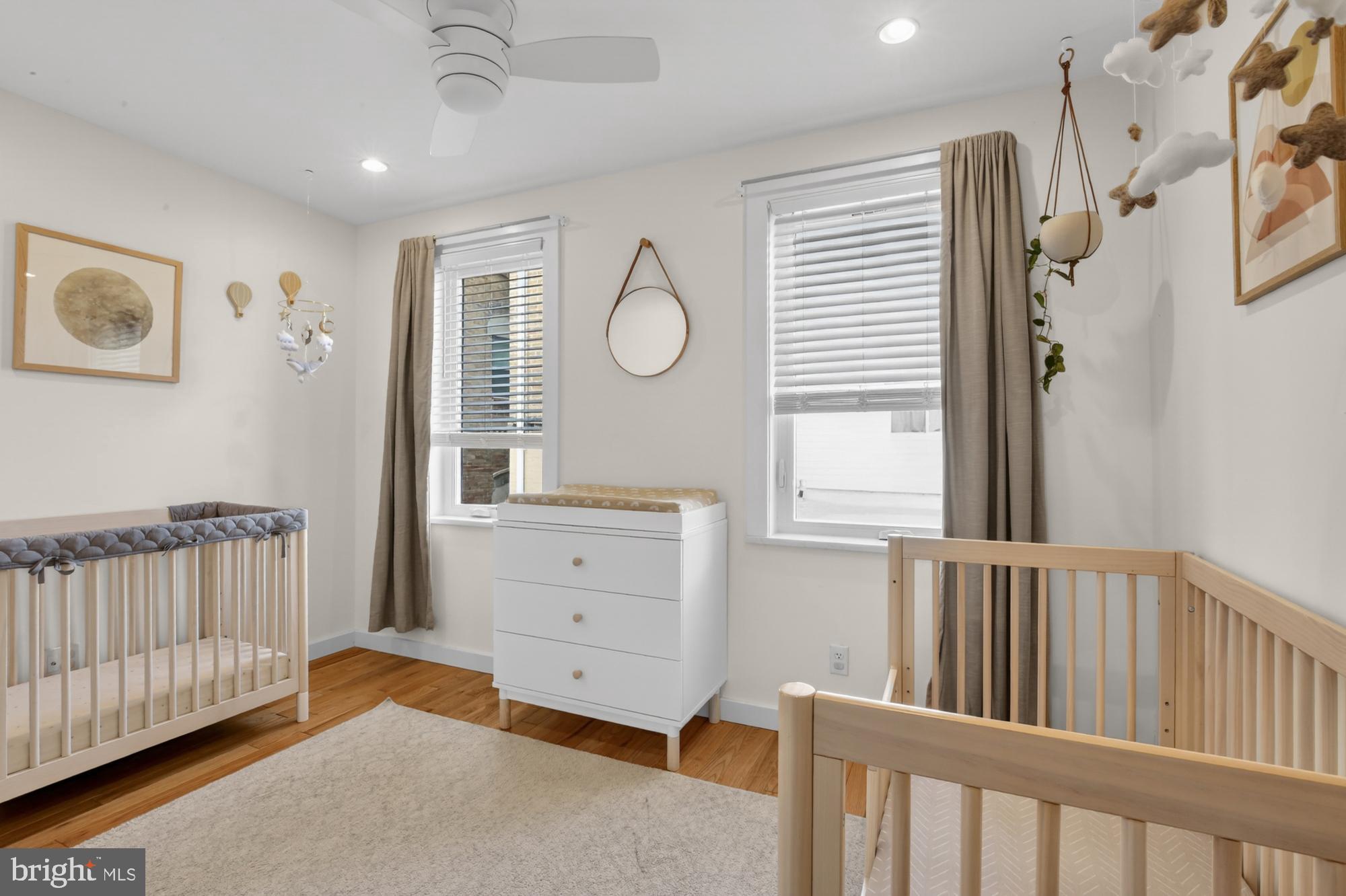741 Watkins Street Philadelphia, PA 19148 - Photo 13 of 25 a bedroom with furniture and a window
