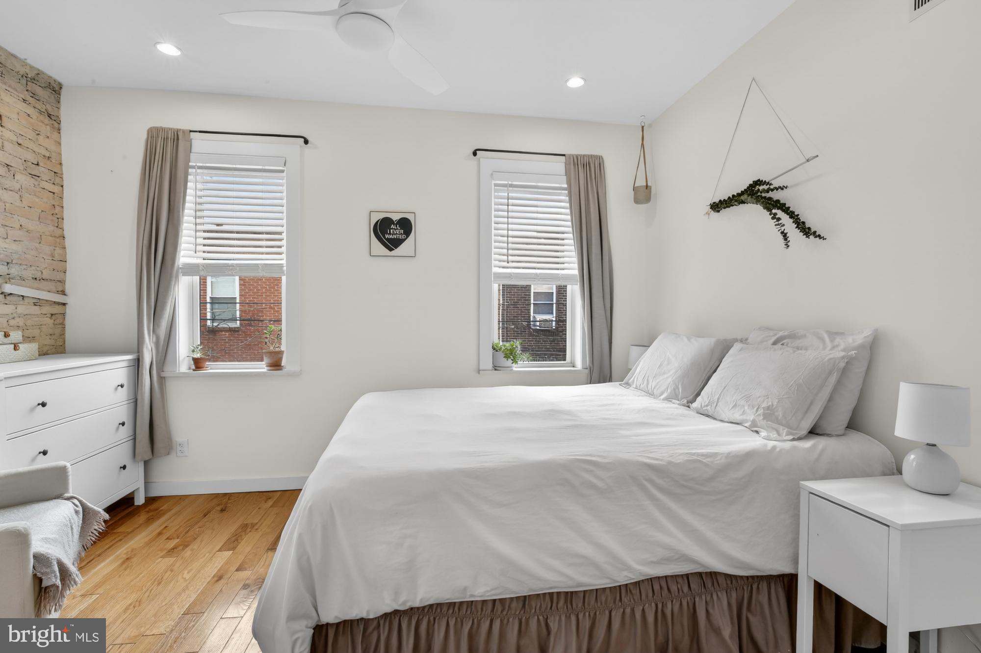 741 Watkins Street Philadelphia, PA 19148 - Photo 19 of 25 a bedroom with a bed and a window