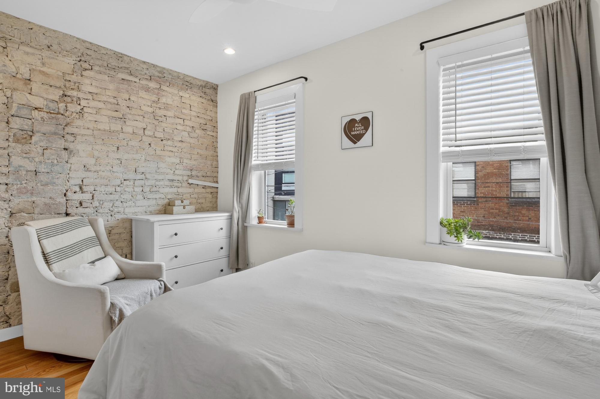 741 Watkins Street Philadelphia, PA 19148 - Photo 20 of 25 a bed room with a bed and a chair