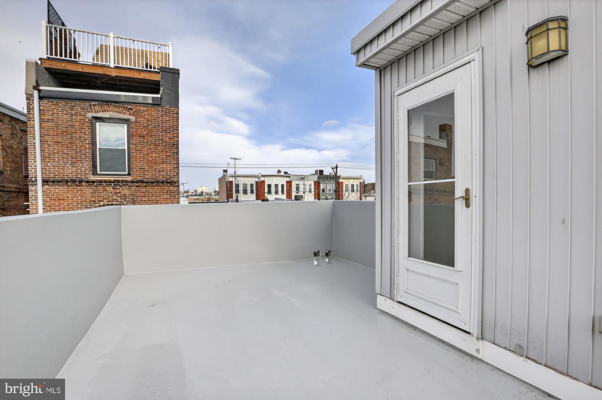 741 Watkins Street Philadelphia, PA 19148 - Photo 23 of 25 a view of balcony and floor to ceiling window