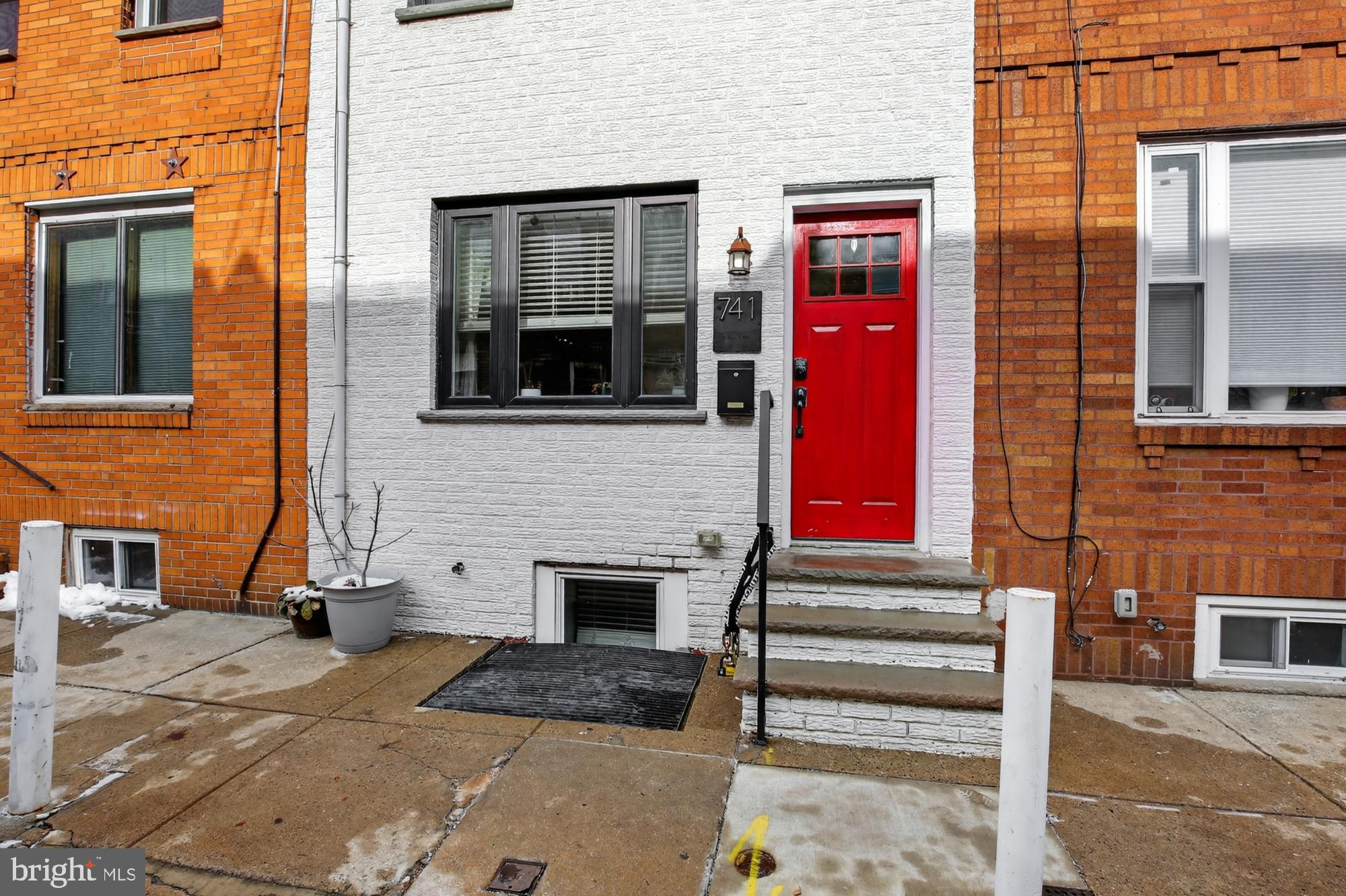 741 Watkins Street Philadelphia, PA 19148 - Photo 24 of 25 a front view of a house with a yard