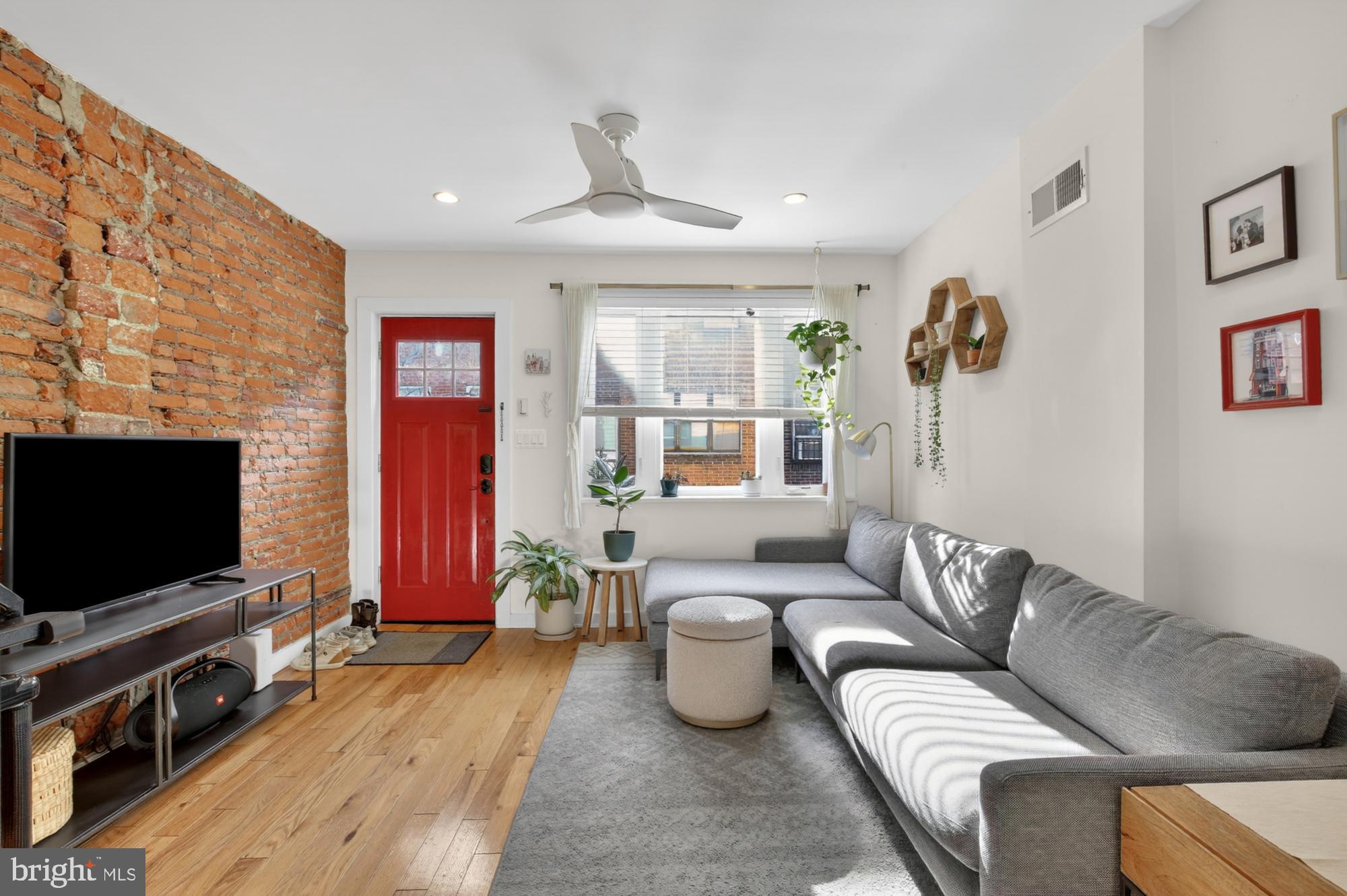741 Watkins Street Philadelphia, PA 19148 - Photo 3 of 25 a living room with furniture and a flat screen tv